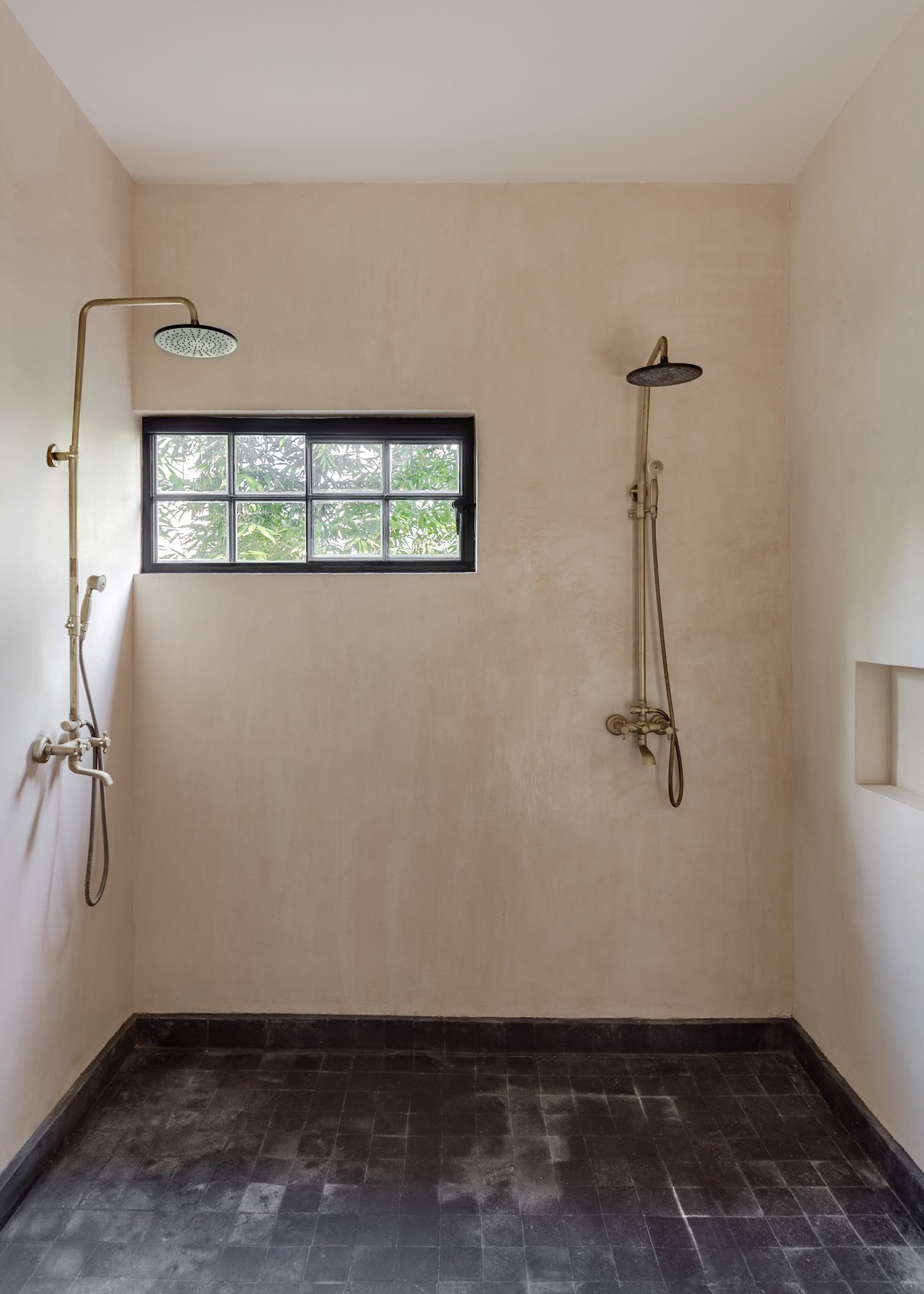 An outdoor shower open to the garden — a small luxury that becomes part of the daily ritual.