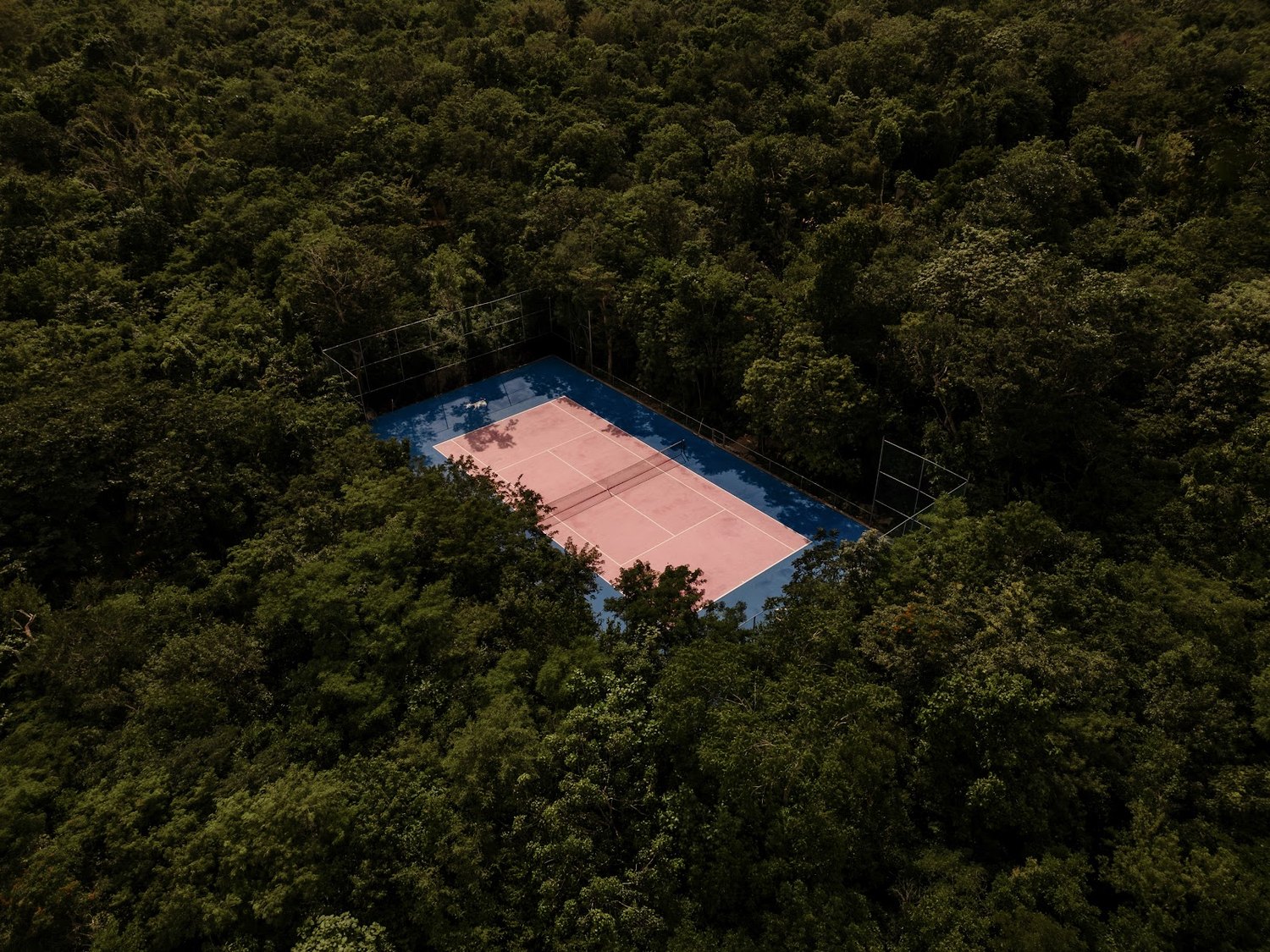 Tucked into the trees on the far side of the grounds &mdash; you&rsquo;d barely know it was there.